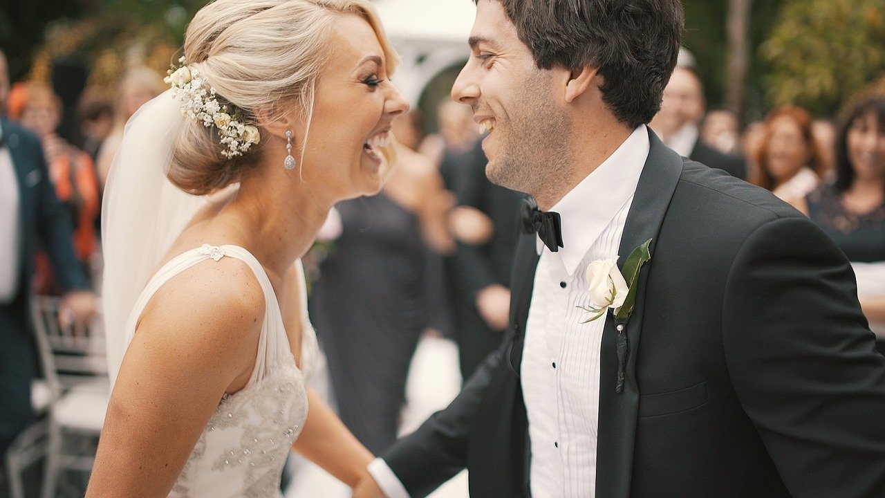 Bride and groom smiling during wedding celebration