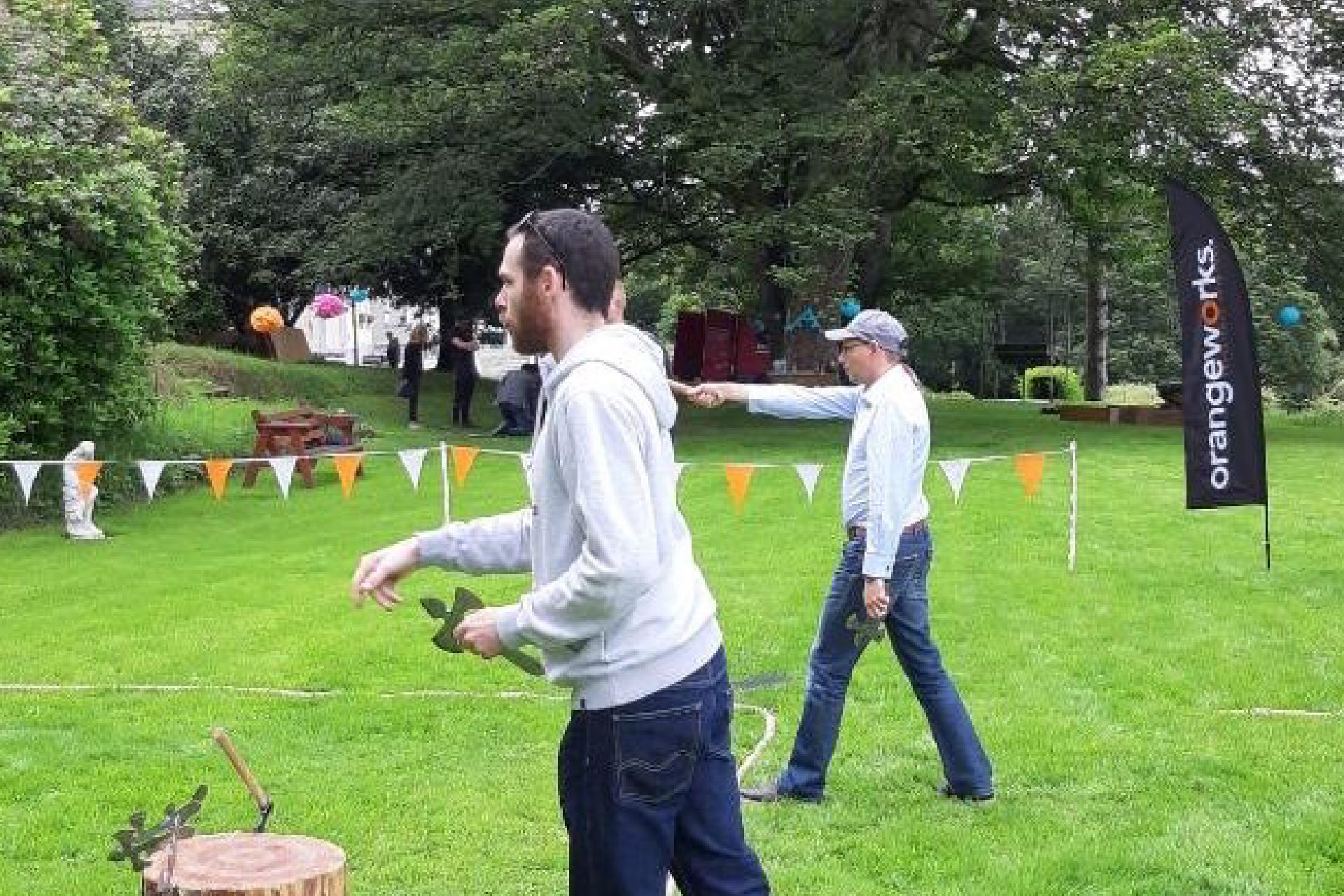 Corporate-04 Men throwing axes at outdoor lawn event