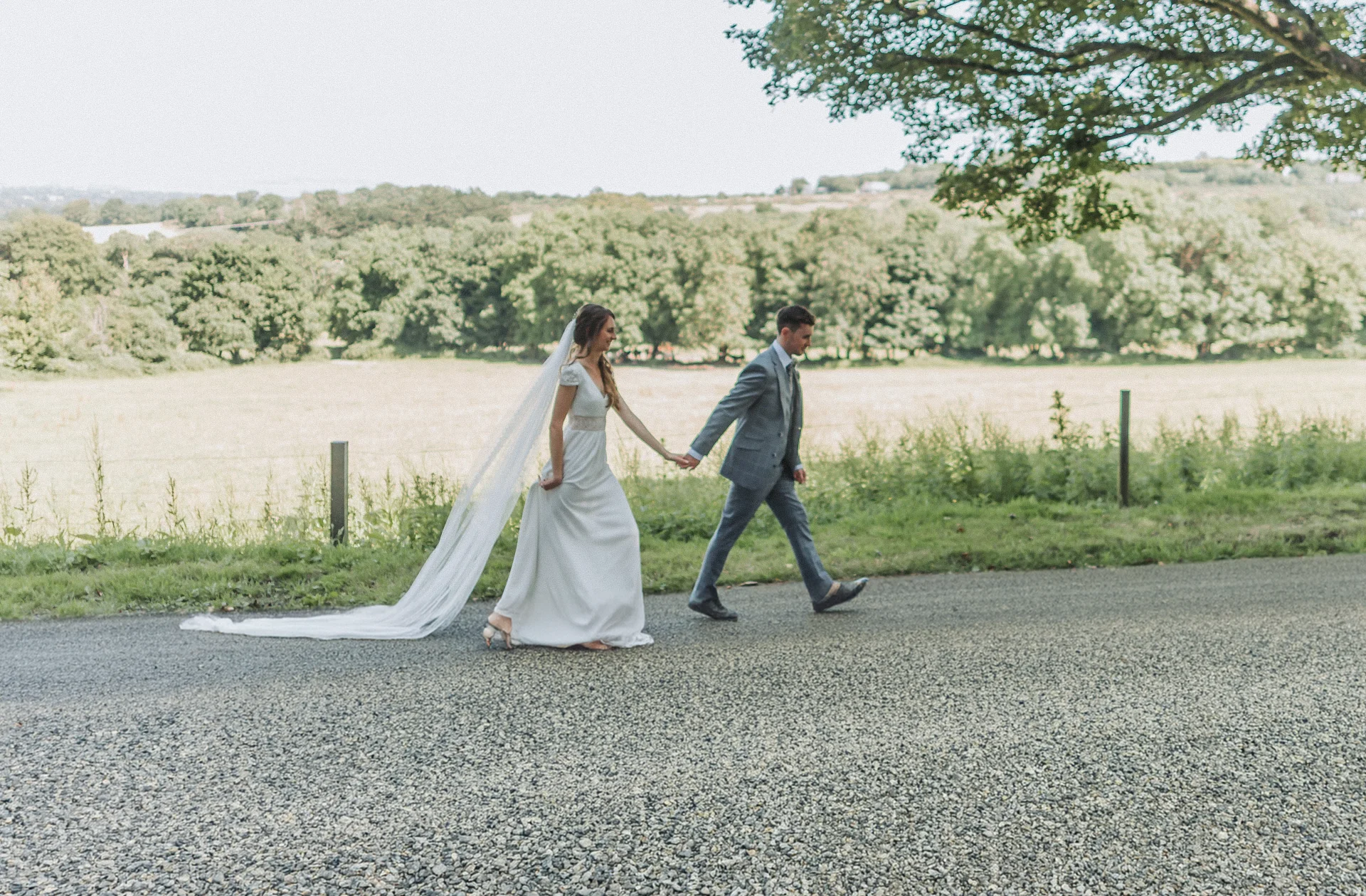 Orlagh Dublin weddings 4 Bride and groom walking on countryside road